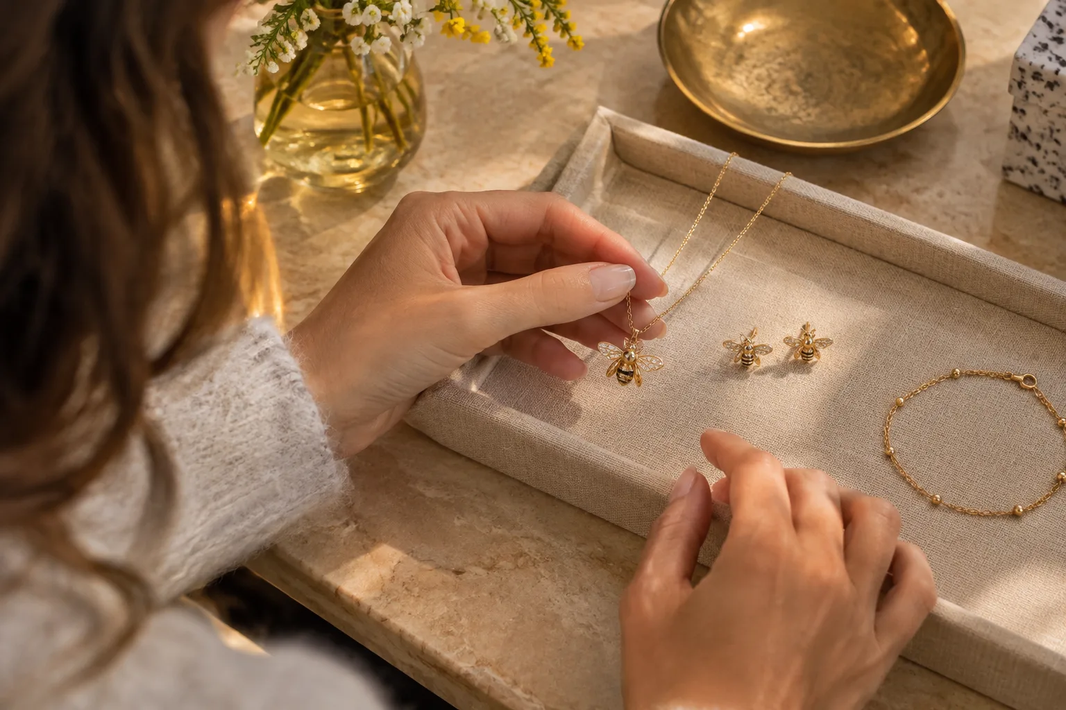 Comparing a bee necklace, bee earrings, and a bracelet for a personal jewelry gift